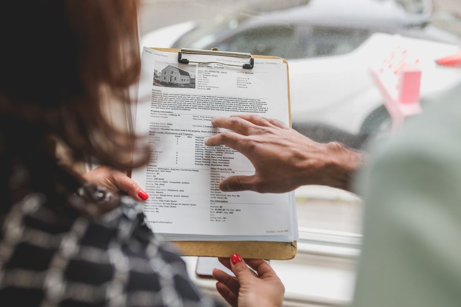 two people examining a document