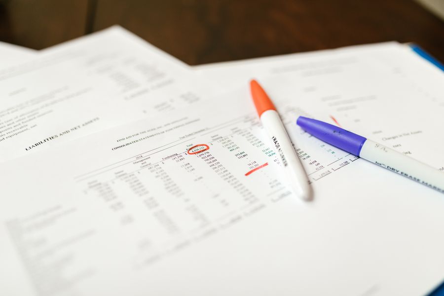 Papers with pens, tax form details