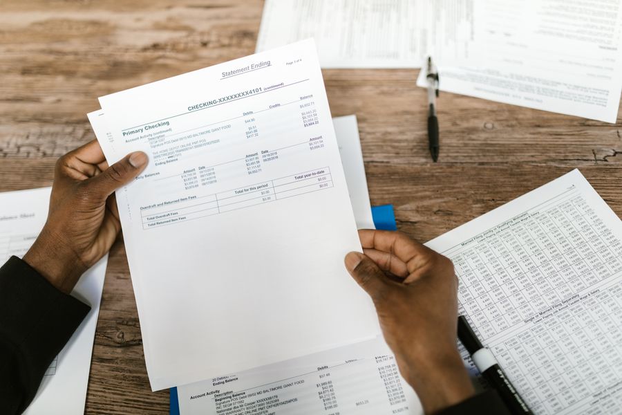 hands holding tax papers